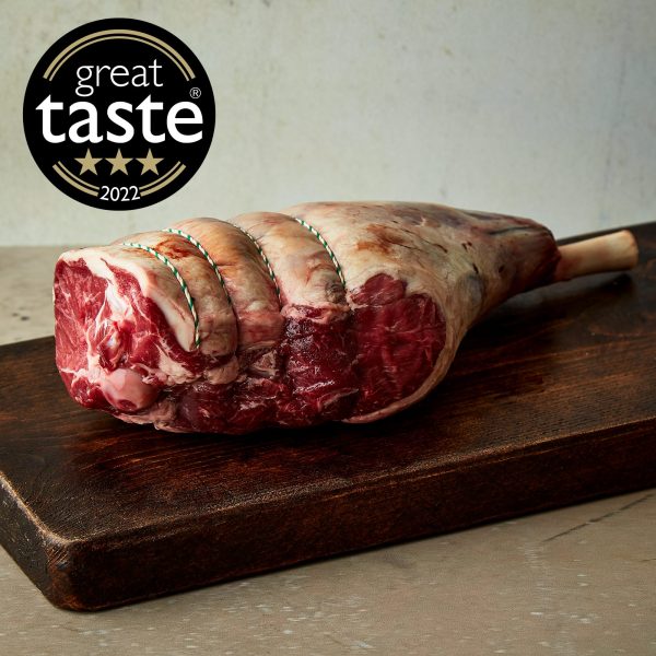 Farm Shop whole lamb leg on a wooden board with Great Taste Award badge