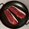 Beef picanha steaks in a pan