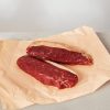 Beef picanha steaks on paper
