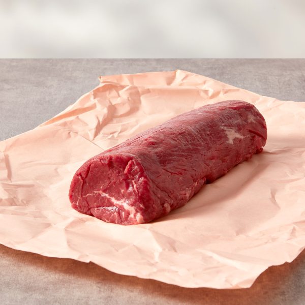 Beef fillet centre cut on pink butchery paper