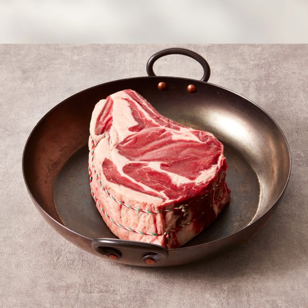 Prime rib of beef in a black pan