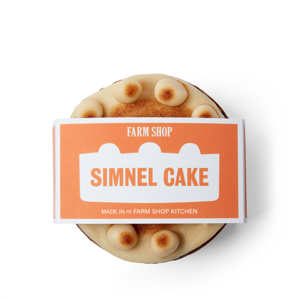 Whole easter simnel cake with marzipan icing and packaging