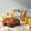 Traditional Colomba Cake on a decorated table with flowers