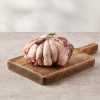 Lamb cushion on a wooden board with rosemary on top