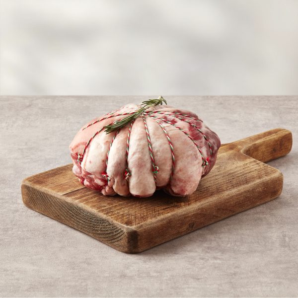 Lamb cushion on a wooden board with rosemary on top