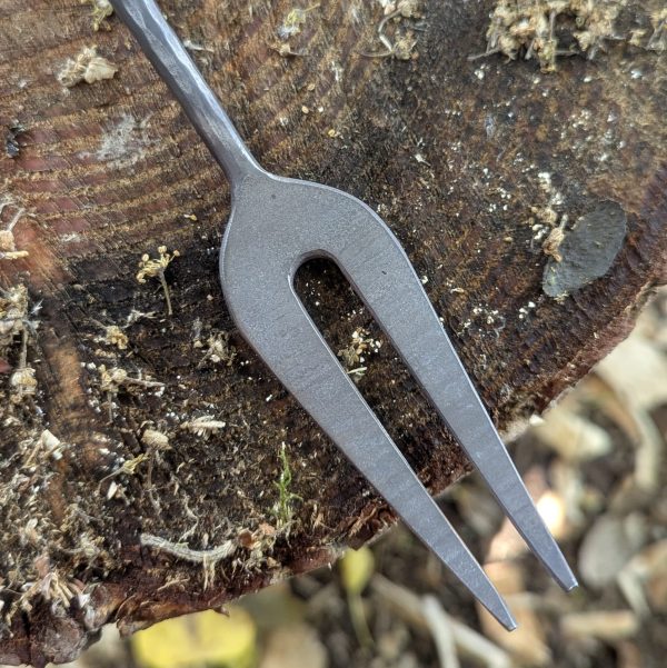 Thorn Wood Forge bbq fork close up on a tree stump