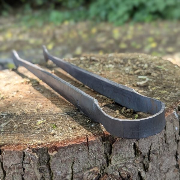 Close up of Thorn Wood Forge bbq tongs handle
