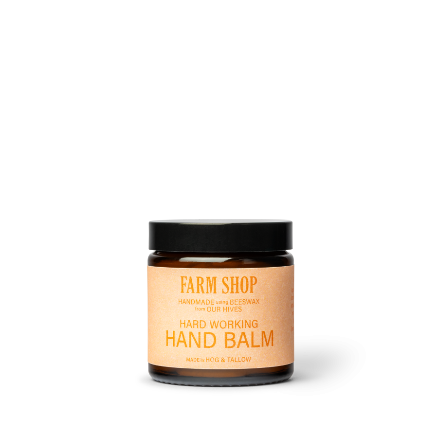 Jar of beeswax hand balm with an orange label